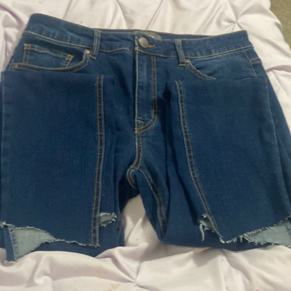 Normal jeans with cut bottom holes